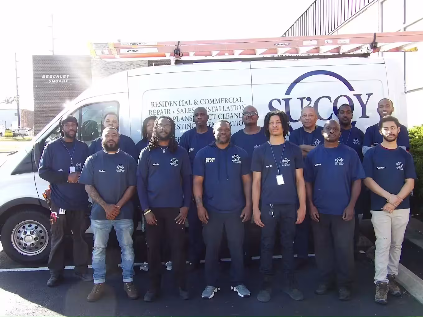 Su'Coy Heating, AC and Duct Cleaning team in front of company van