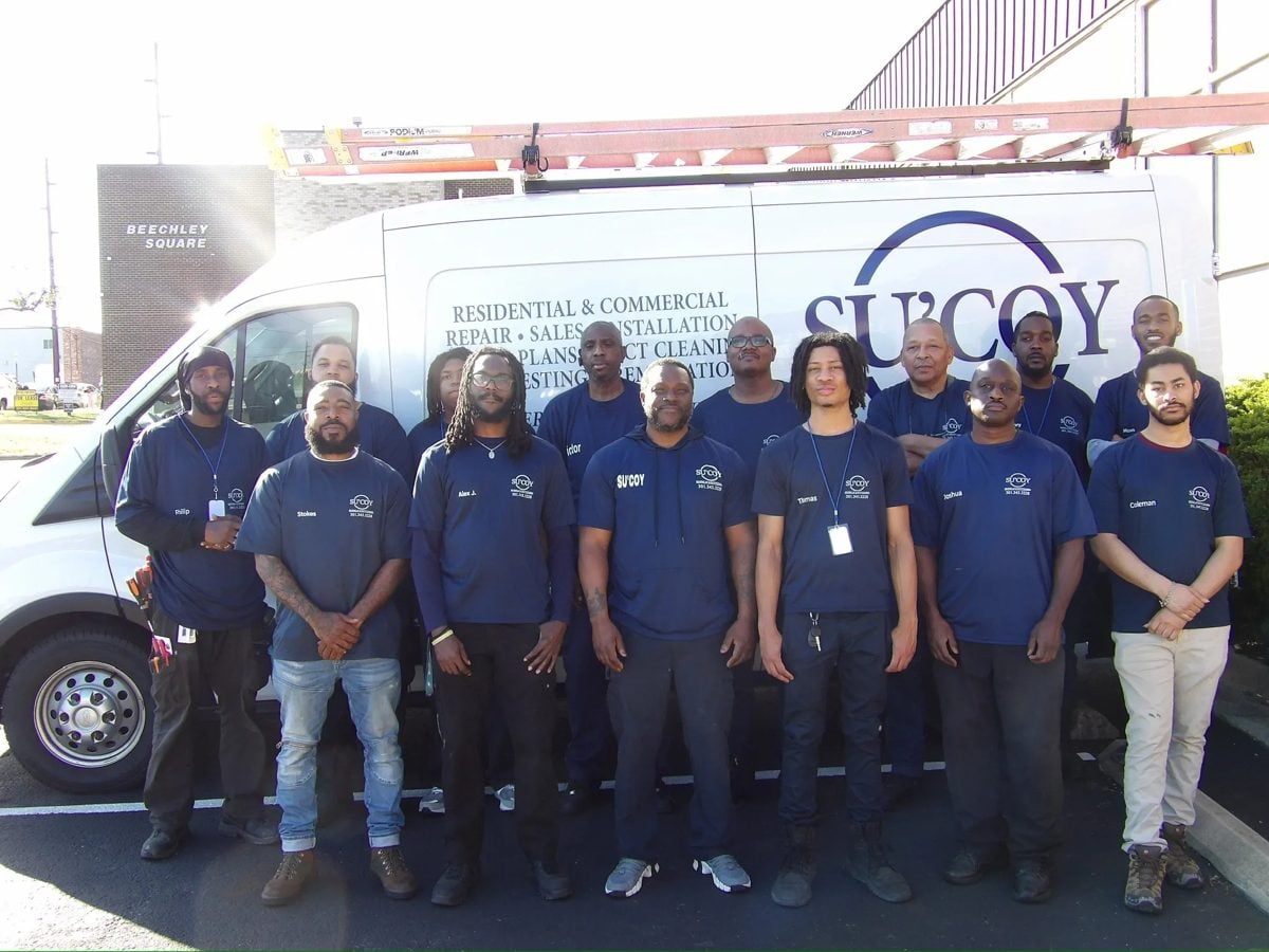 The Su’Coy crew in front of their branded service van